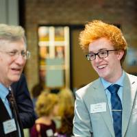 Student laughing with a donor at Scholarship Dinner 2019